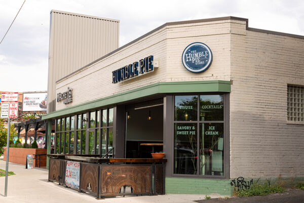 Humble Pie restaurant with patio and garage door.