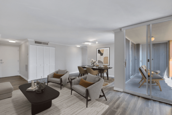 living room with focus on the couches and the dining area in the background