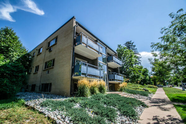 1120 York apartment building with lush landscaping and large balconies.