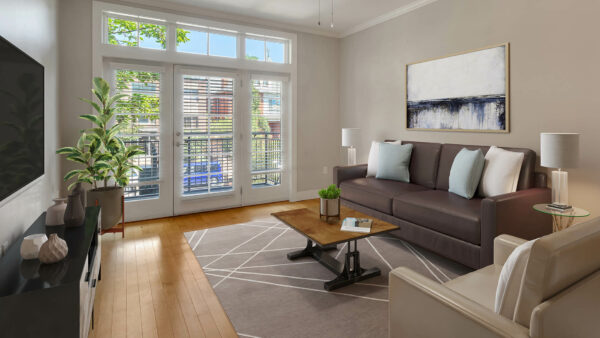 Living room with wood floor, geometric rug, modern furniture, and door to balcony.