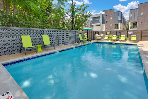 1190 Birch pool area with clean blue water and lounge chairs.
