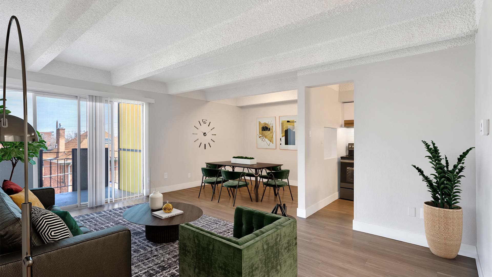 Living area with modern living room, comfortable dining room with clock, and door to balcony.