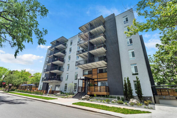 1311 Cook apartments with large balconies and lush landscaping.