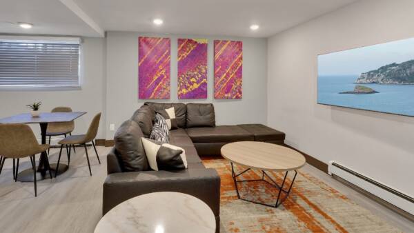 amenity space with large couch and tv
