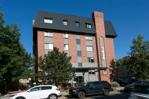 1430 Humboldt apartments with brick construction, large windows, and ample parking.