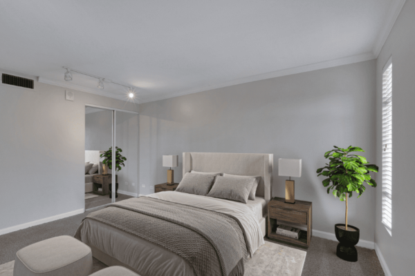 large bedroom with bed and closet