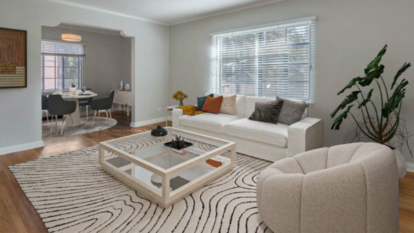 Living room with plush seating, modern furniture, and artwork.