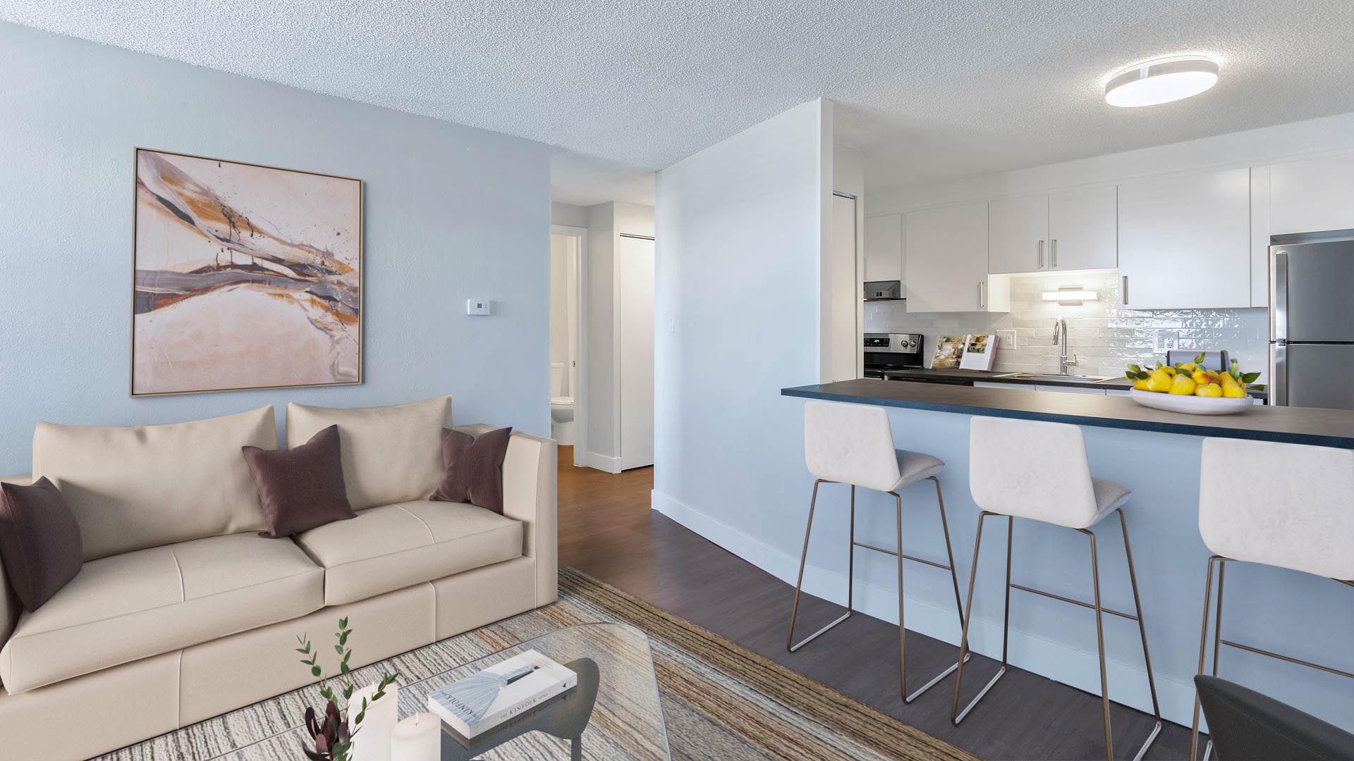 Apartment living room with modern furniture and breakfast bar with opening to kitchen.