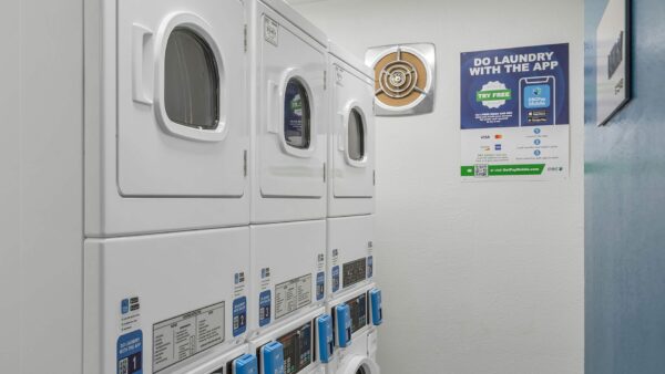 Laundry room with washers and dryers.
