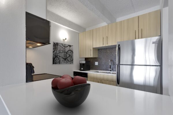 kitchen with stainless steel appliances and light wood cabinets
