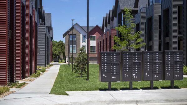 Dayton Station townhomes courtyard with lush green lawns and mailboxes.