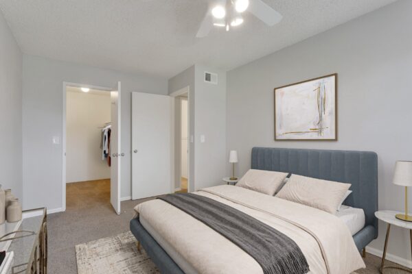 bedroom with large bed, window and ceiling fan