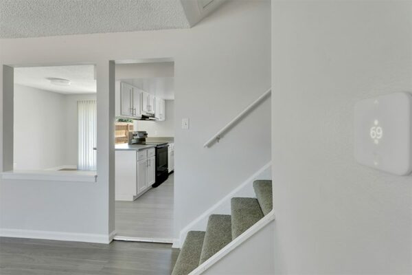 Stairway to bedrooms, overlooking kitchen.