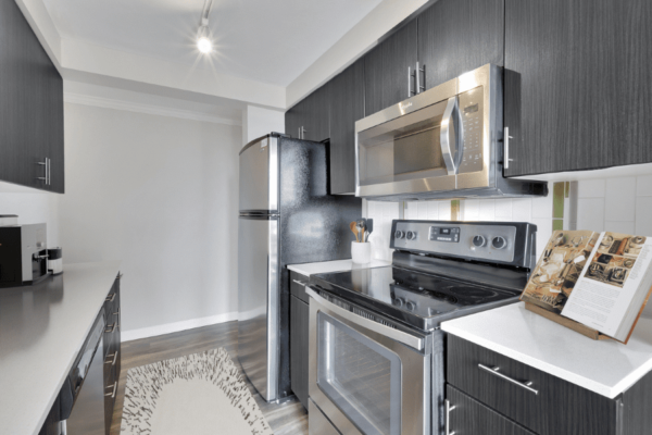 kitchen with dark wood cabinets and stainless steel appliances