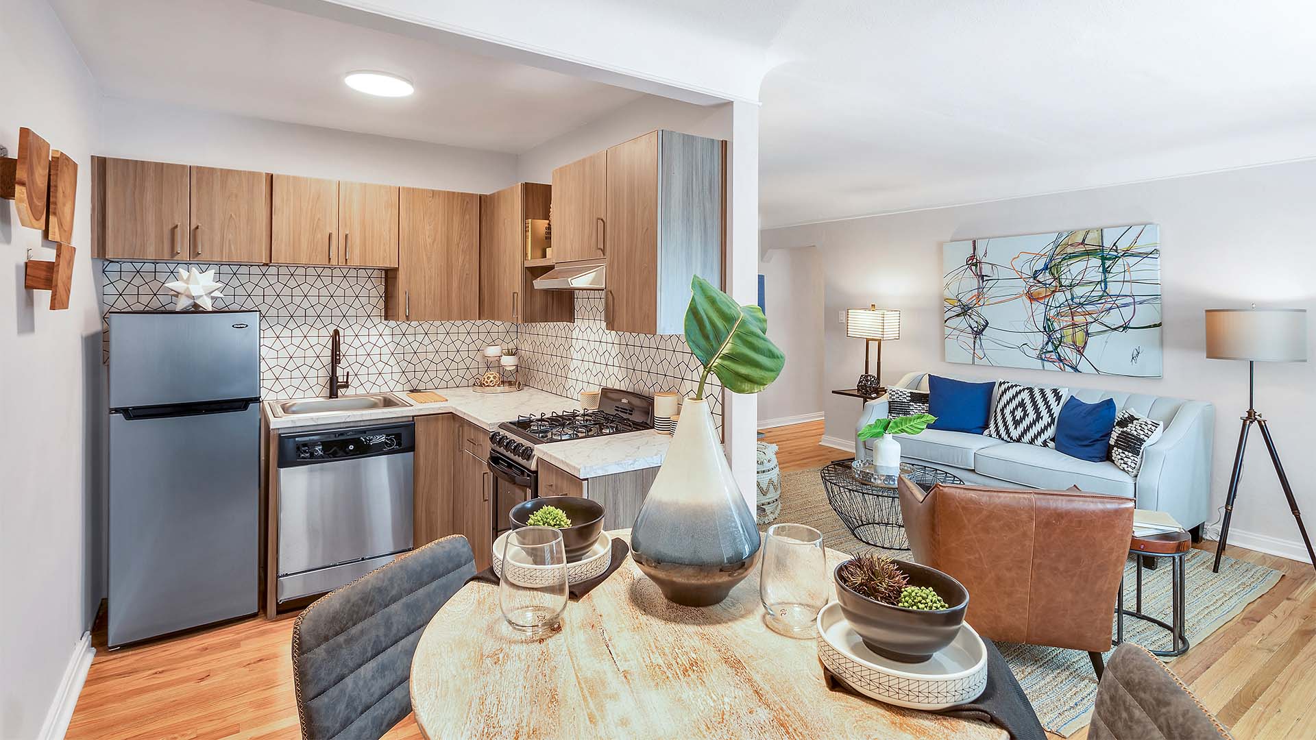 Living area with updated kitchen, comfortable dining room, and plush living room.