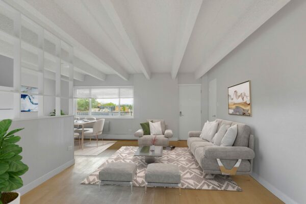 Living room with wood floor, plush rug, comfortable seating, and dining table.