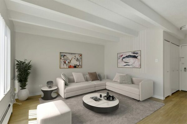 Image of furnished living room with clean decor and natural light