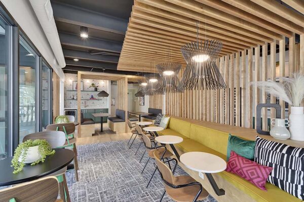 Bright, colorful, modern post-renovation lounge at 1280 Lafayette.