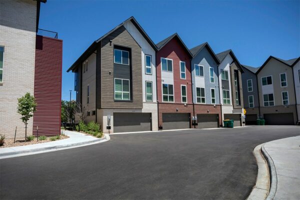 Three story Dayton Station townhomes with garages and ample street parking.
