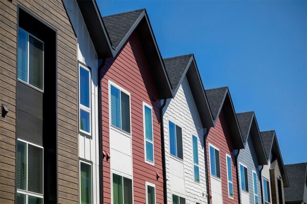 Dayton Station townhomes with colorful siding and large windows.