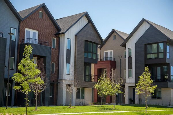 Dayton Station townhomes with lush green courtyard and newly planted trees.