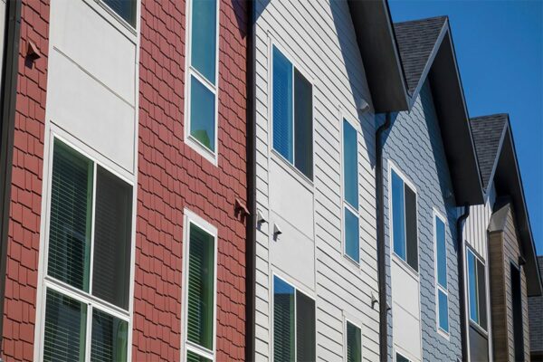 Dayton Station townhomes with colorful siding and large windows.