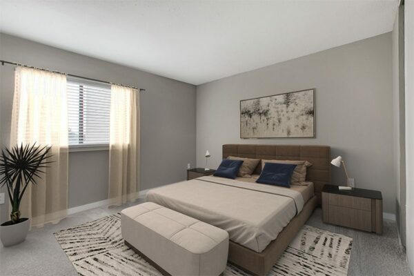 Bedroom with carpet, large bed with plush headboard, modern bedside tables with lamps, and large window.