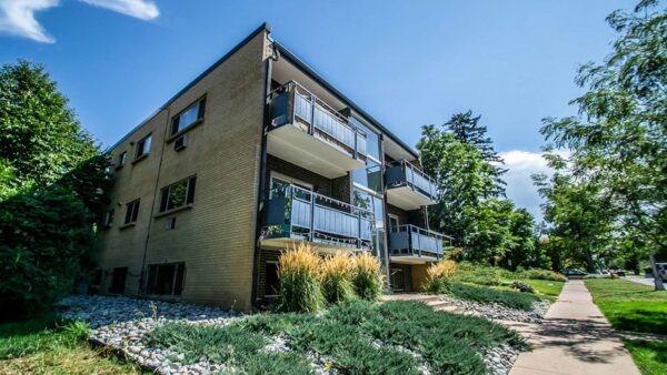 1120 York apartment building with lush landscaping and large balconies.