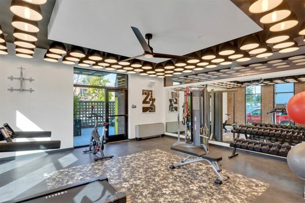 Fitness center with cardio machines and weight equipment.