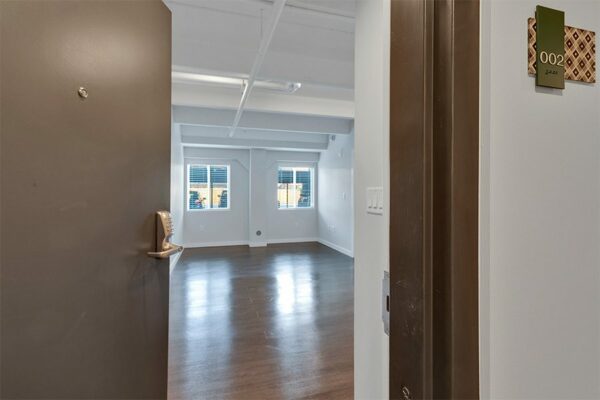 Entry to unit 002 living room with keypad lock.