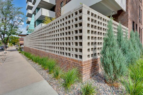 Detail of cinderblock corner wall outside the Scot apartments.