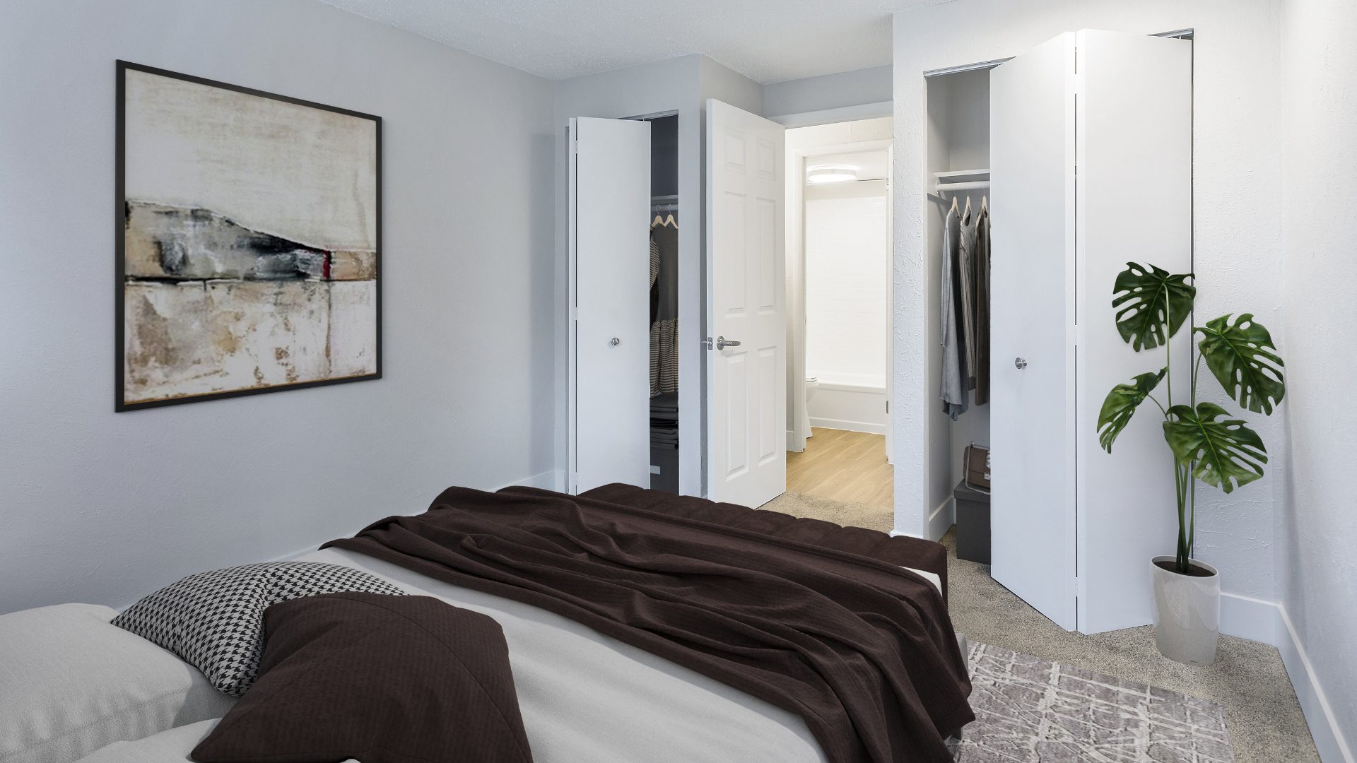 one bedroom apartment with large bed and en suite bathroom