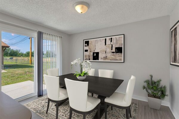 Dining room area with dining table and chairs.