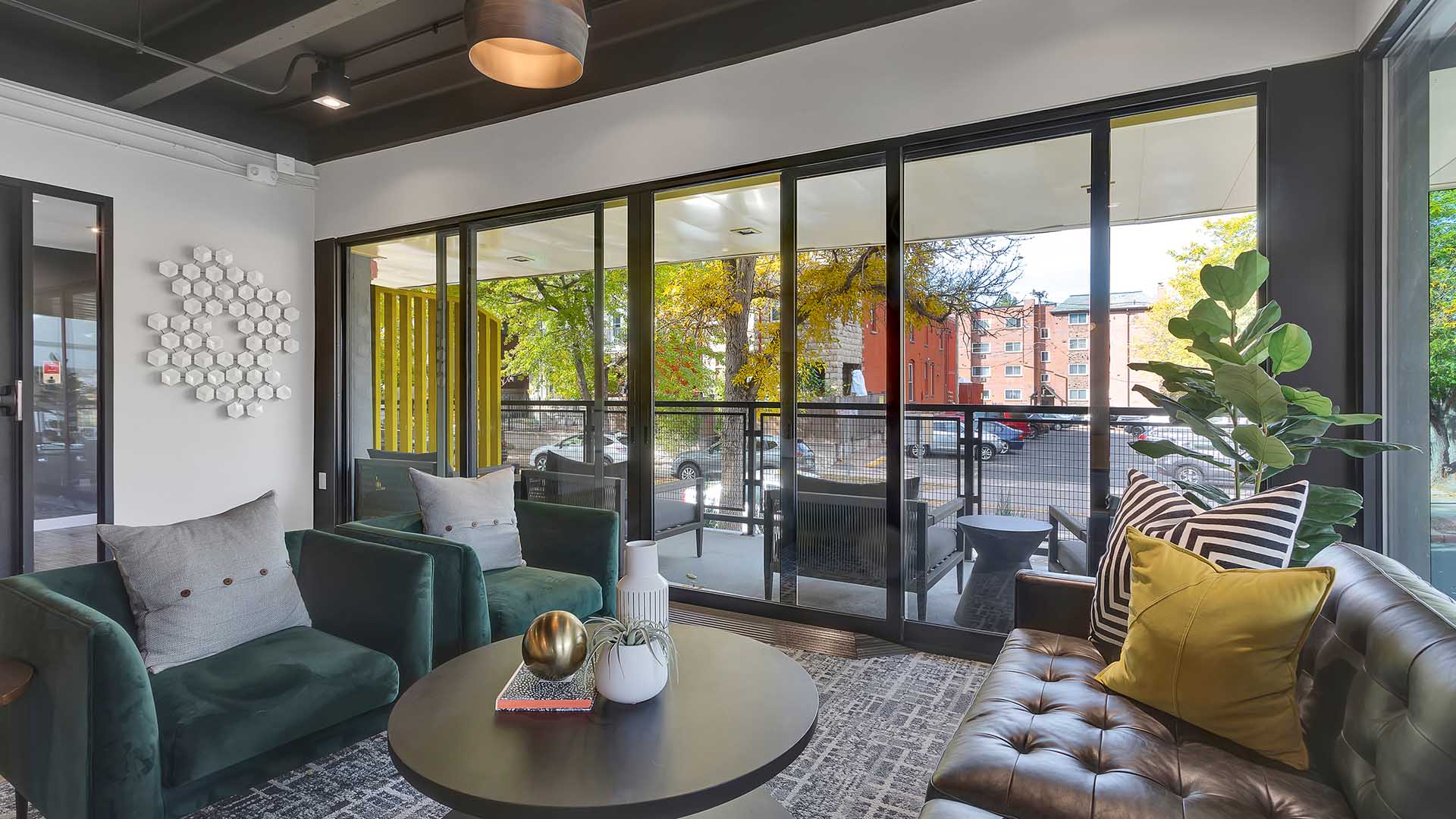 1280 Lafayette apartment entrance with lounge area and modern architecture.