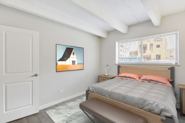 one bedroom with large bed and window