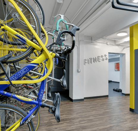Bicycle storage room with bikes stored on frames.