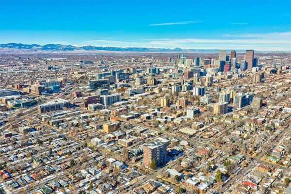 Aerial view of 50 Corona looking northwest towards downtown Denver and the mountains.