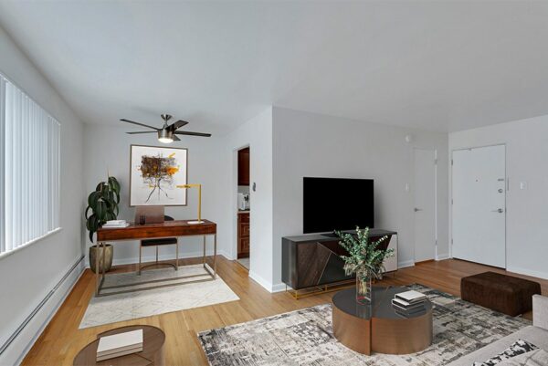 Living room with TV console, modern furniture, and desk.