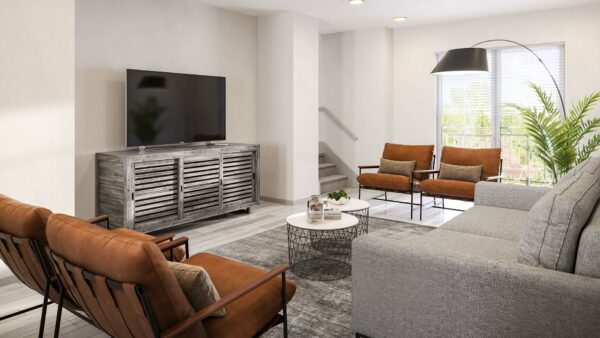 Living room with plush seating, eclectic decor, large TV, and stairs.