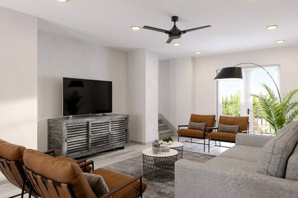 Living room with plush seating, eclectic decor, large TV, and stairs.