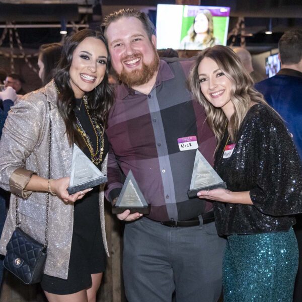 RedPeak employees smiling and celebrating at awards ceremony.