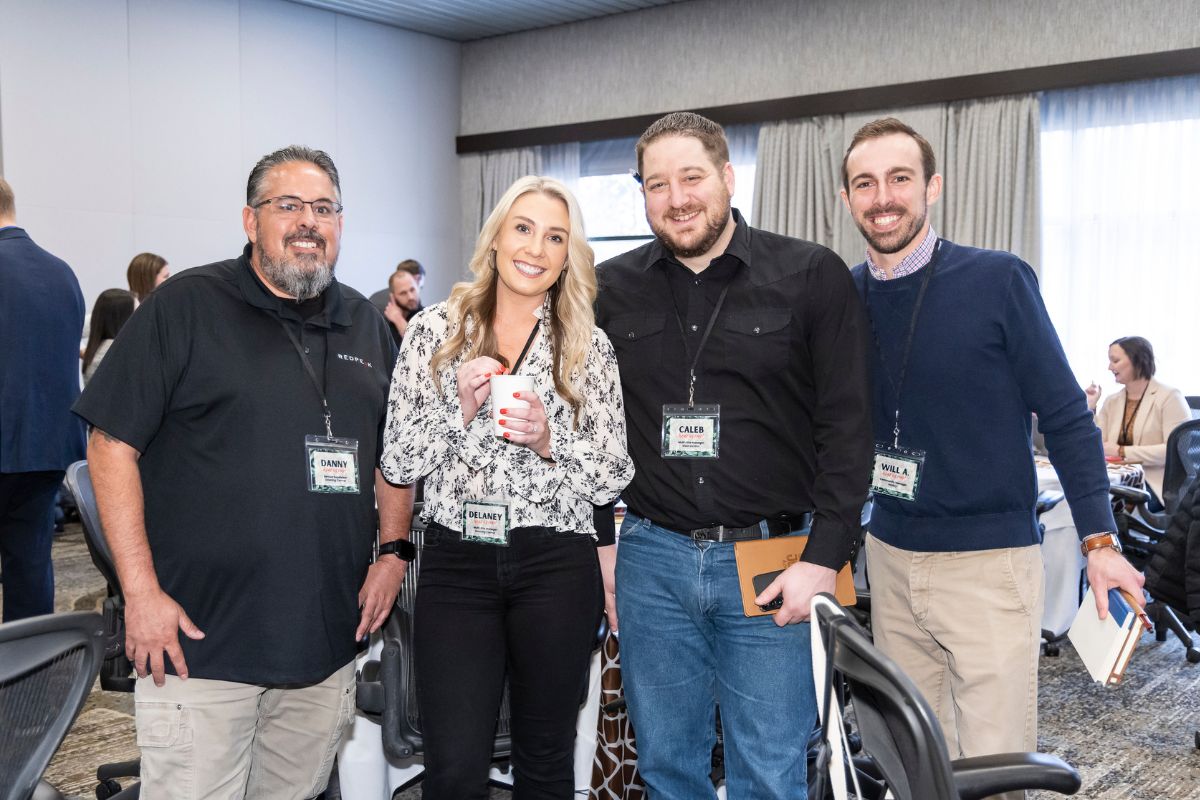 image of four team members posing for a photo