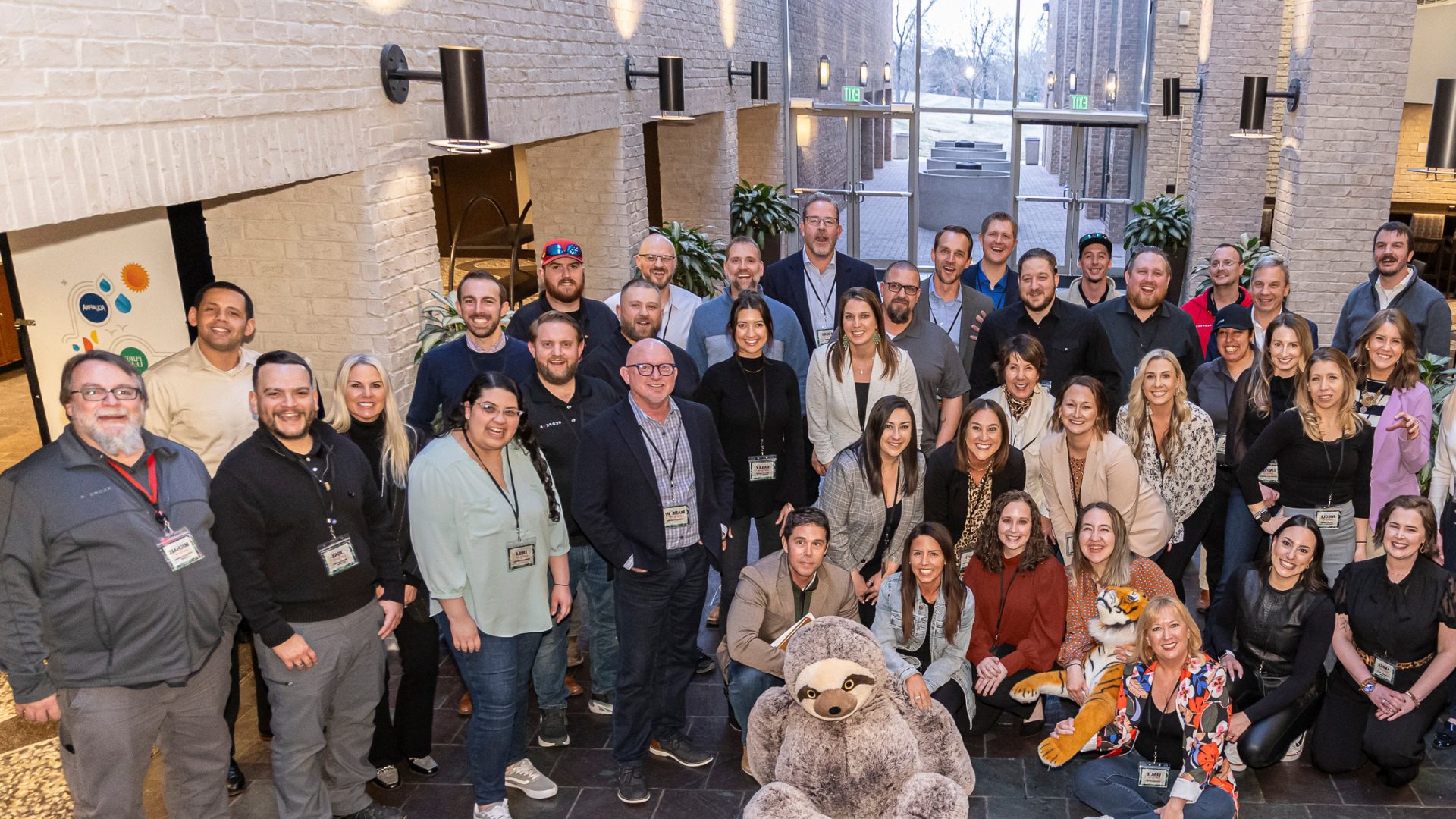 group of team members posing during a conference
