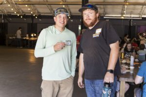 two team members posing for photo