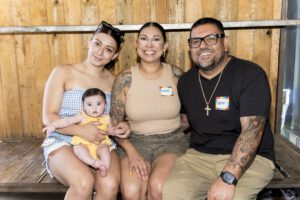 family of 4 posing for a picture