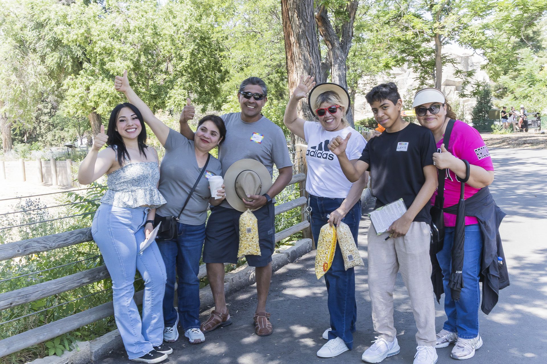 six friends having fun and posing for phot at the zoo