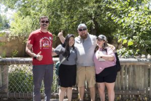 four people having fun and posing