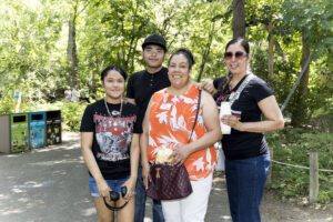 family of 4 posing for picture